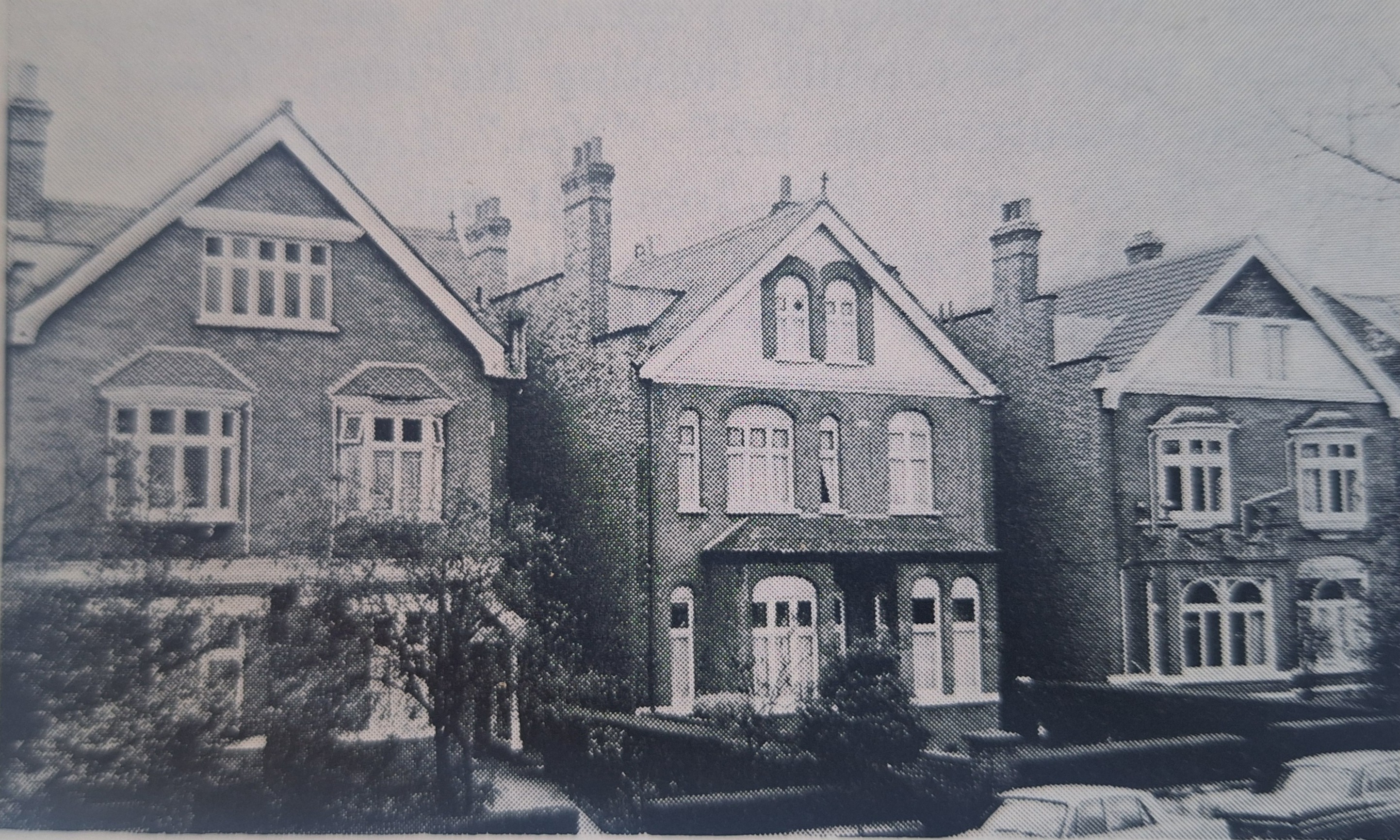 Black and white photo of three houses in London